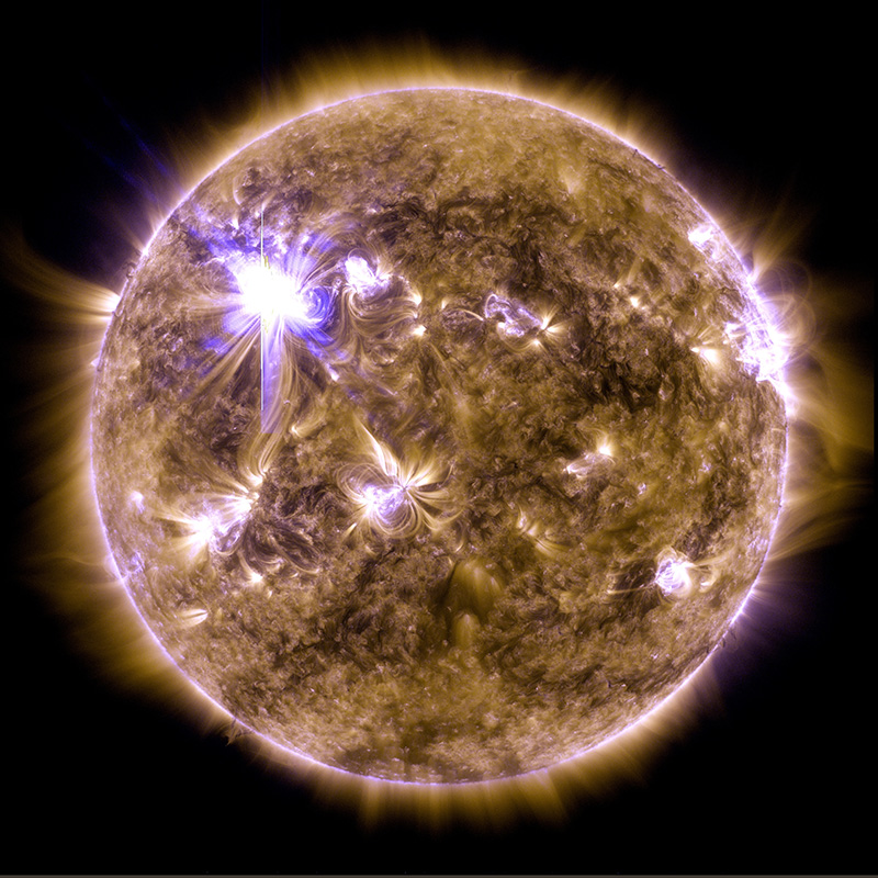 an ultraviolet light photo of the sun and a large solar flare on march 7, 2012