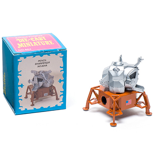 a die cast pencil sharpener in the shape of the apollo moon lander